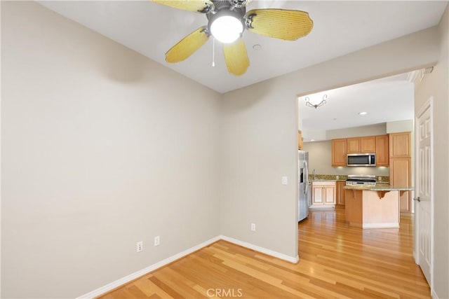 interior space featuring ceiling fan and light wood-type flooring