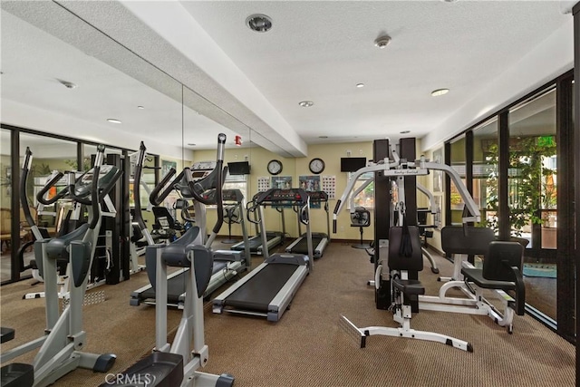 gym with a textured ceiling