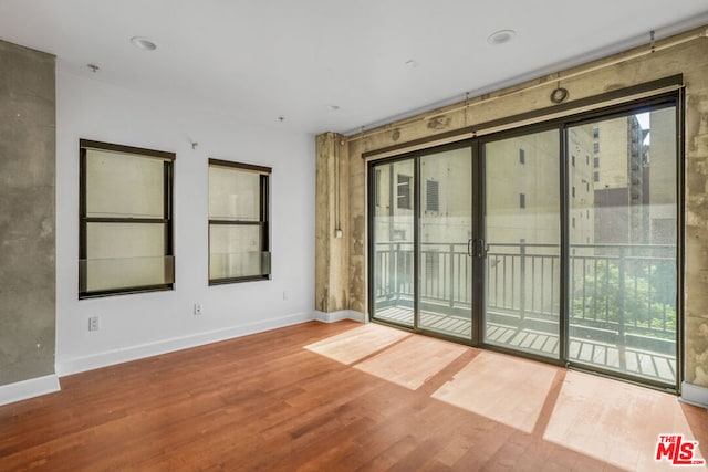 spare room featuring hardwood / wood-style floors