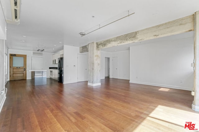 unfurnished living room with light hardwood / wood-style flooring