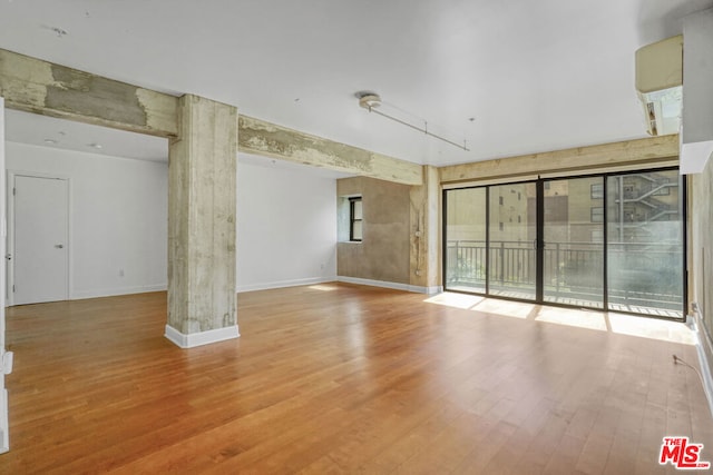 spare room featuring light wood-type flooring