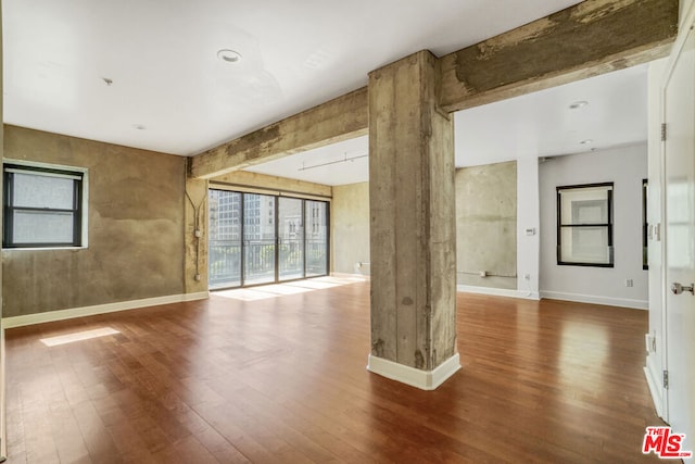 unfurnished room featuring wood-type flooring