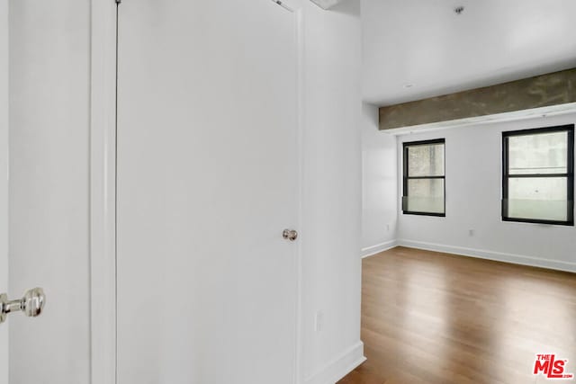 unfurnished room featuring hardwood / wood-style flooring