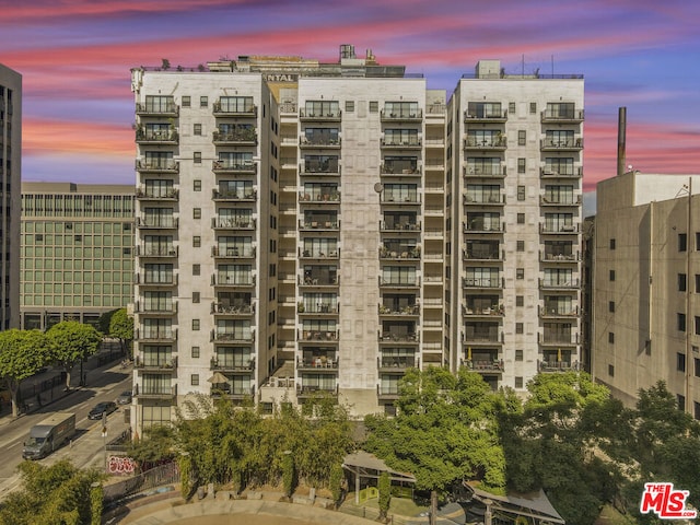 view of outdoor building at dusk