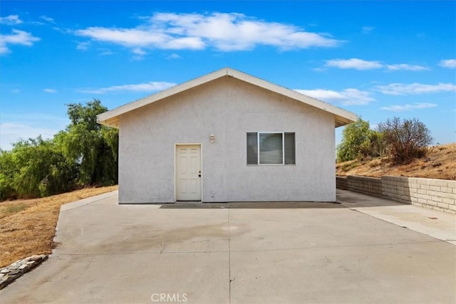 rear view of property featuring a patio