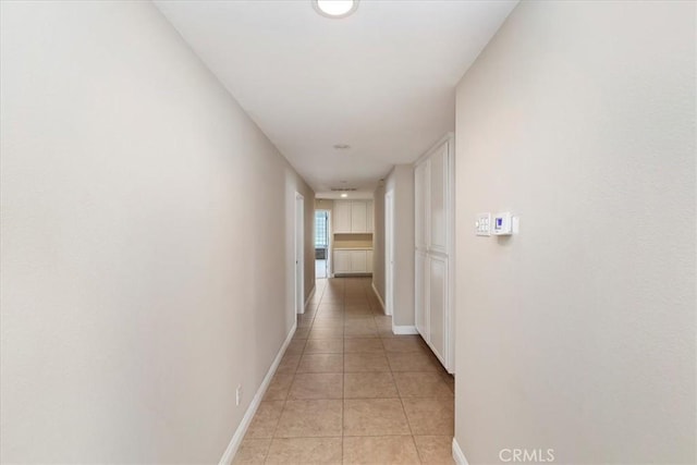 hallway with light tile patterned flooring