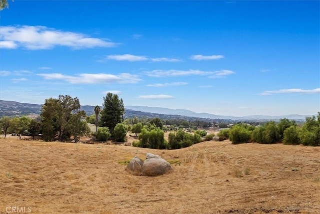 property view of mountains featuring a rural view