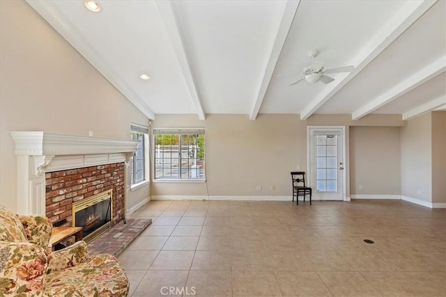 unfurnished living room with ceiling fan, light tile patterned flooring, lofted ceiling with beams, and a fireplace