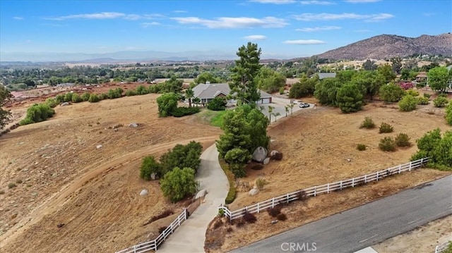 birds eye view of property featuring a rural view and a mountain view