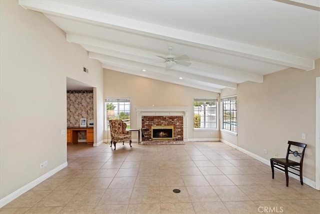 unfurnished living room with ceiling fan, light tile patterned flooring, a fireplace, and vaulted ceiling with beams