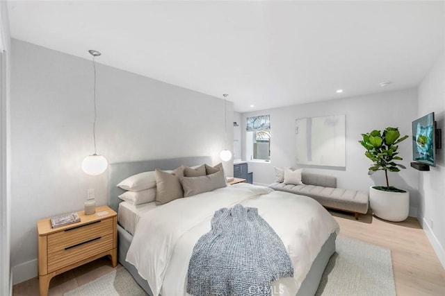 bedroom with light wood-type flooring