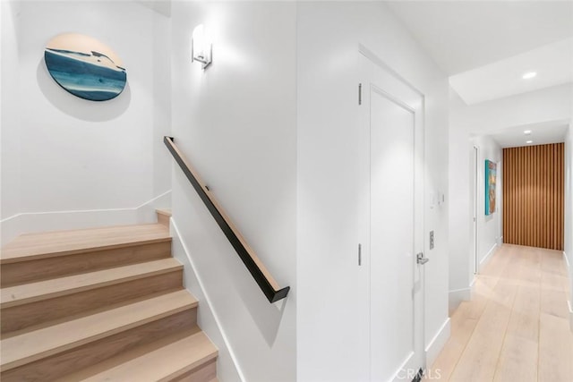 stairway featuring wood-type flooring