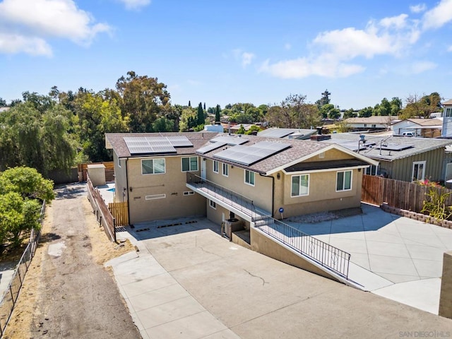 view of front of property with solar panels