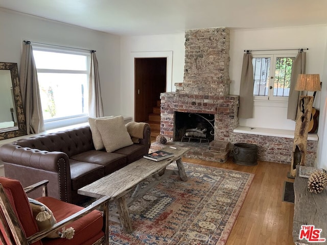 living room with light wood-type flooring and a wealth of natural light