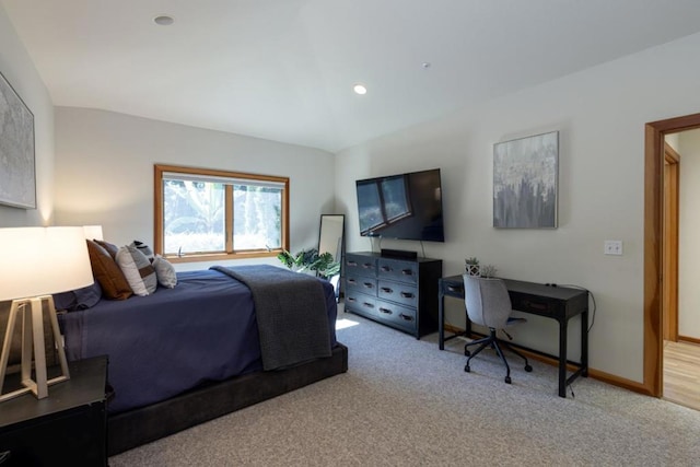 bedroom featuring light colored carpet