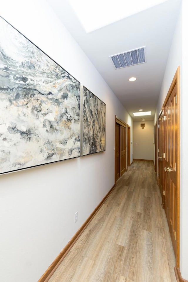 corridor featuring light hardwood / wood-style flooring