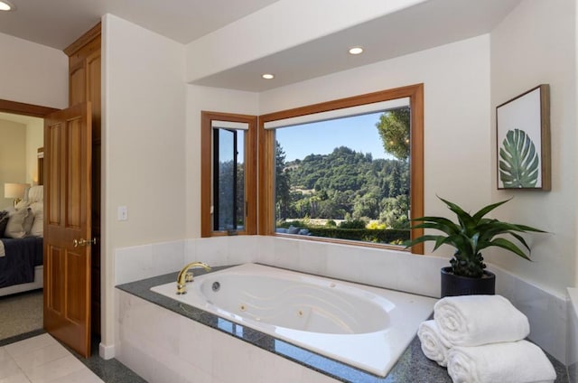 bathroom featuring tiled tub