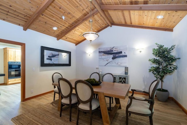 dining room with wood ceiling, light hardwood / wood-style flooring, and lofted ceiling with beams