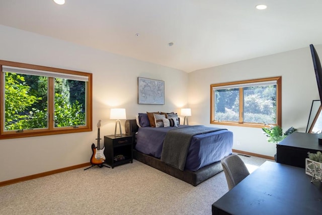 bedroom with light colored carpet