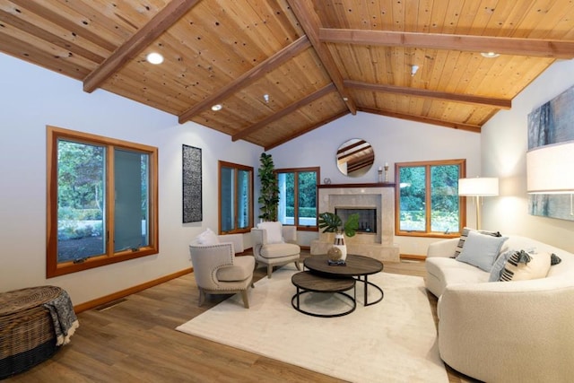 living room featuring a premium fireplace, hardwood / wood-style floors, wooden ceiling, and beam ceiling