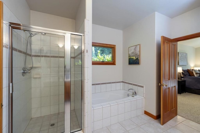 bathroom with plus walk in shower and tile patterned flooring