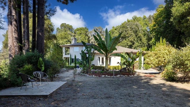 back of property featuring a patio