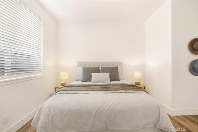 bedroom with light hardwood / wood-style flooring