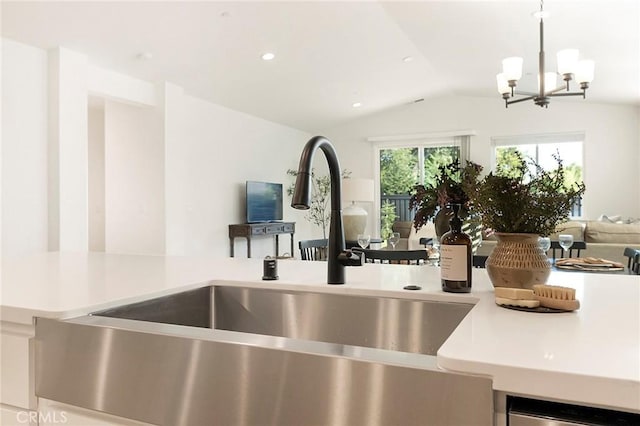 interior details featuring sink, hanging light fixtures, and a chandelier