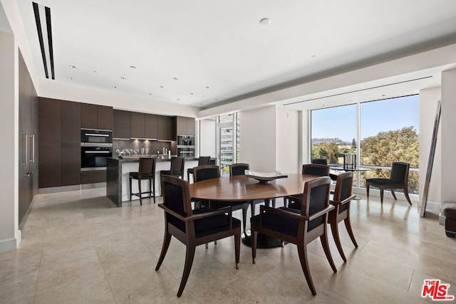 dining room featuring light tile patterned floors