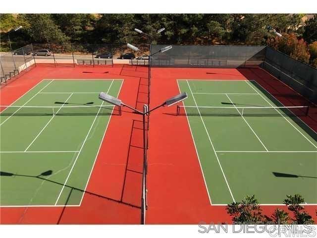 view of sport court featuring basketball hoop