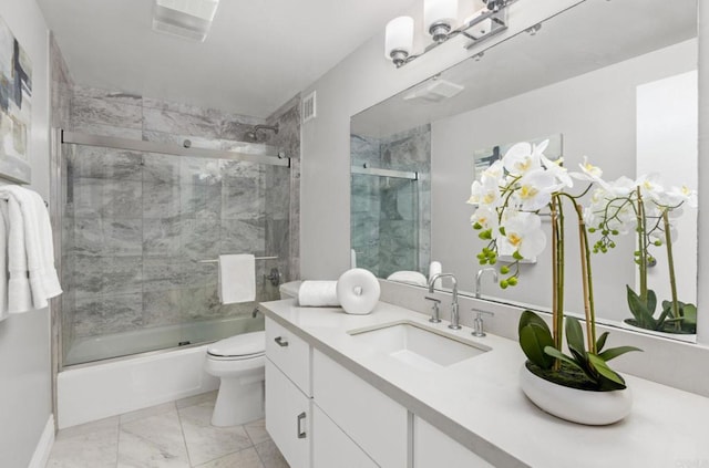 full bathroom with toilet, combined bath / shower with glass door, and vanity