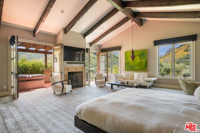 bedroom featuring beam ceiling, carpet flooring, a fireplace, and high vaulted ceiling