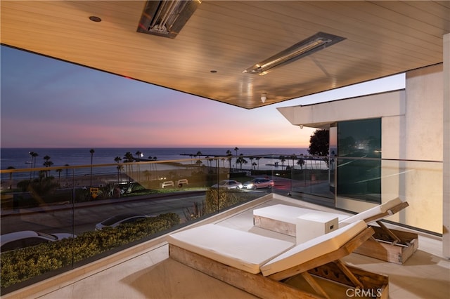 balcony at dusk with a water view