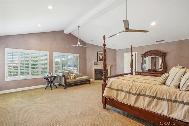 carpeted bedroom featuring lofted ceiling with beams and ceiling fan