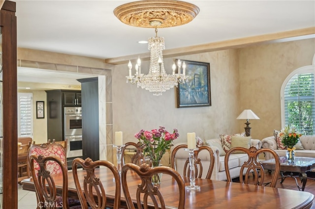 dining space with an inviting chandelier