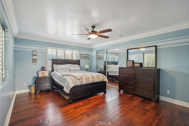 bedroom featuring ornamental molding, ceiling fan, and dark hardwood / wood-style flooring