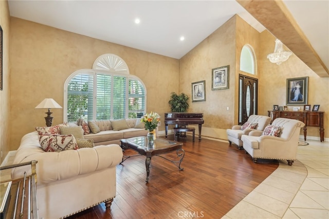 living room with a notable chandelier and hardwood / wood-style flooring