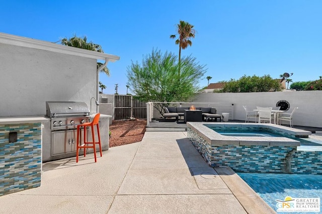 view of pool featuring a patio area and an in ground hot tub