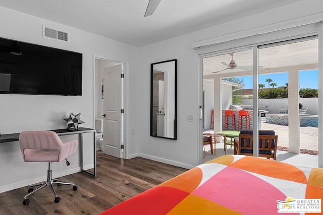 bedroom with access to exterior, ceiling fan, and dark wood-type flooring