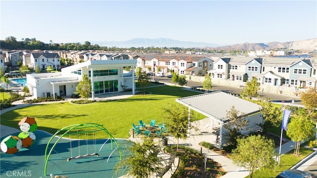 birds eye view of property featuring a mountain view