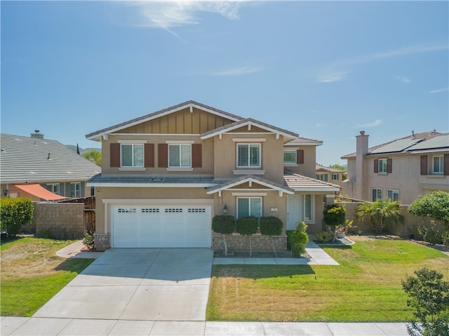 view of front of property with a front lawn and a garage