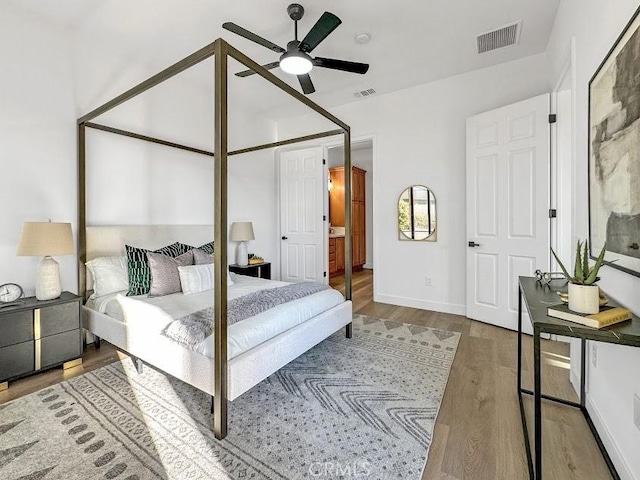 bedroom featuring hardwood / wood-style floors and ceiling fan