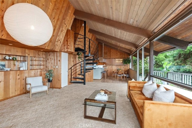 living room with carpet, lofted ceiling with beams, wood ceiling, and wooden walls