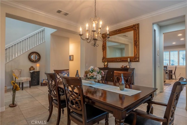 dining space with light tile patterned floors, crown molding, and an inviting chandelier