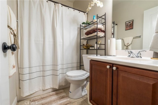 bathroom with tile patterned floors, vanity, toilet, and a shower with curtain