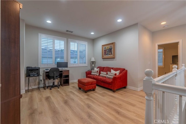 living room with light hardwood / wood-style flooring