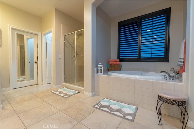 bathroom featuring tile patterned flooring and plus walk in shower