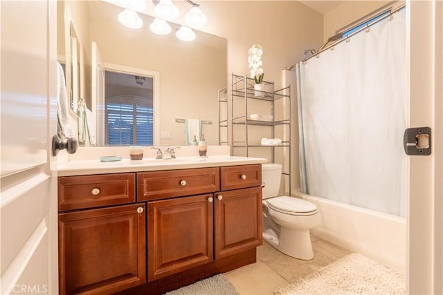 full bathroom with tile patterned flooring, shower / tub combo, vanity, and toilet