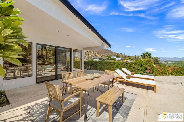 view of patio featuring a mountain view