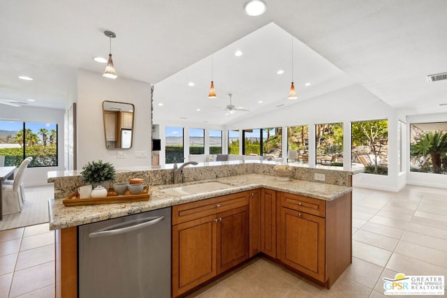 kitchen with decorative light fixtures, vaulted ceiling, dishwasher, sink, and plenty of natural light